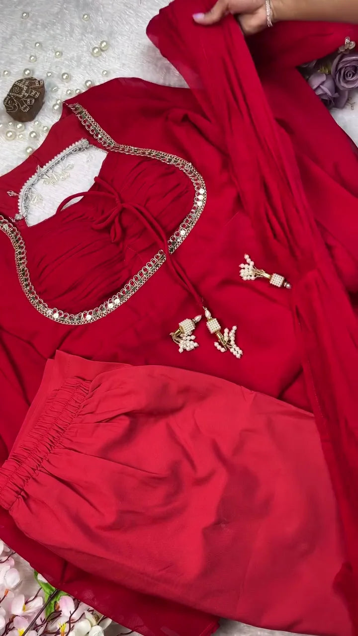 Exquisite Deep Red Chiffon Ethnic Kurta Set with Intricate Gold Mirror Work Neckline, Drawstring Detail, Pearl Tassel Accents, and Matching Comfort-Fit Trousers and Dupatta