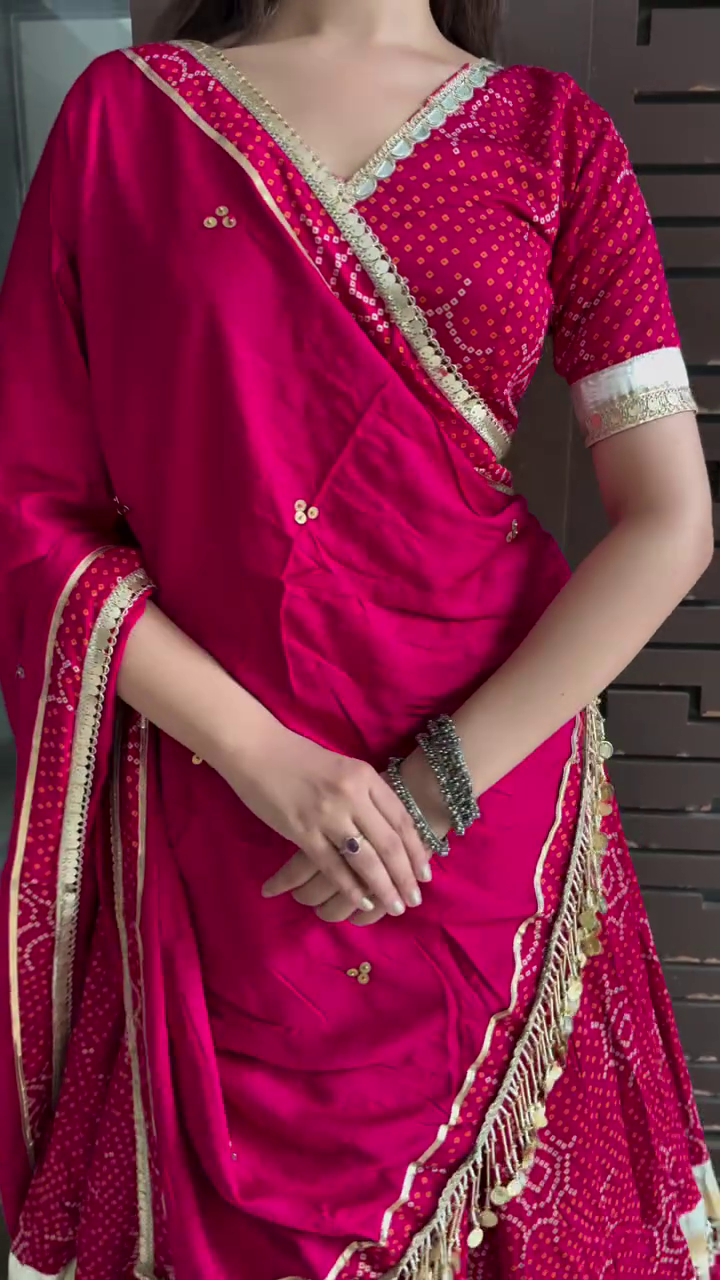 Elegant Red Embroidered Lehenga Choli with Tassel Detail and Traditional Gold Border for Festive Occasions and Weddings