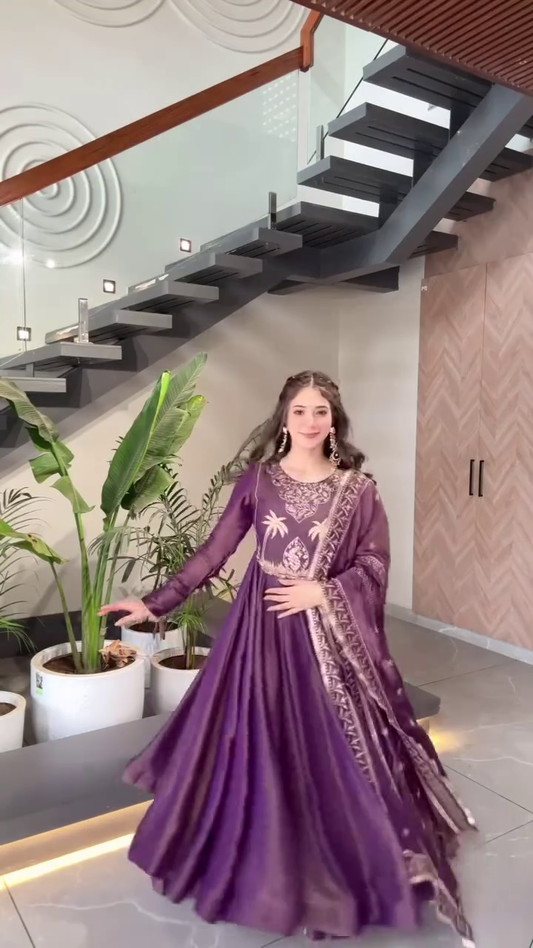 Elegant Purple Anarkali Gown with Embroidered Detailing and Flowing Dupatta – Perfect for Weddings, Festive Occasions, and Traditional Celebrations.