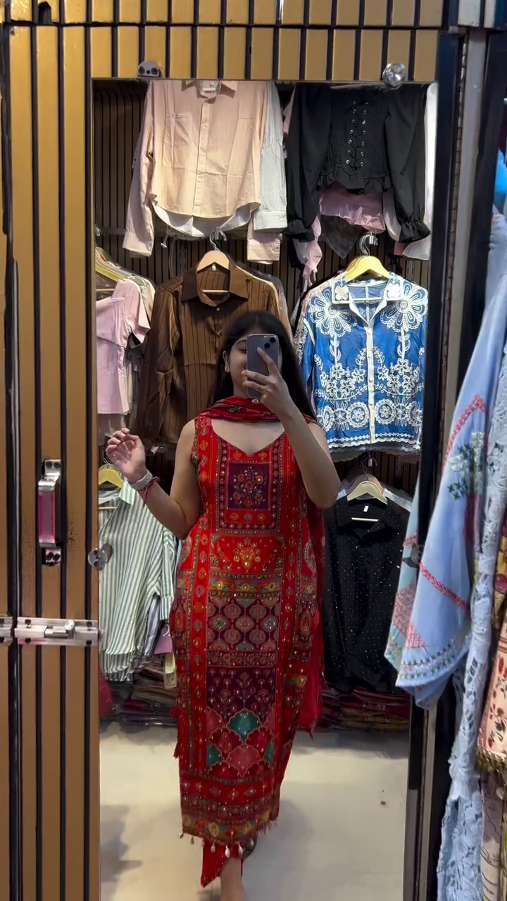 Traditional Red Embroidered Kurta Set with Colorful Geometric Patterns, Tassel Detailing, and Matching Dupatta for a Regal Festive Look