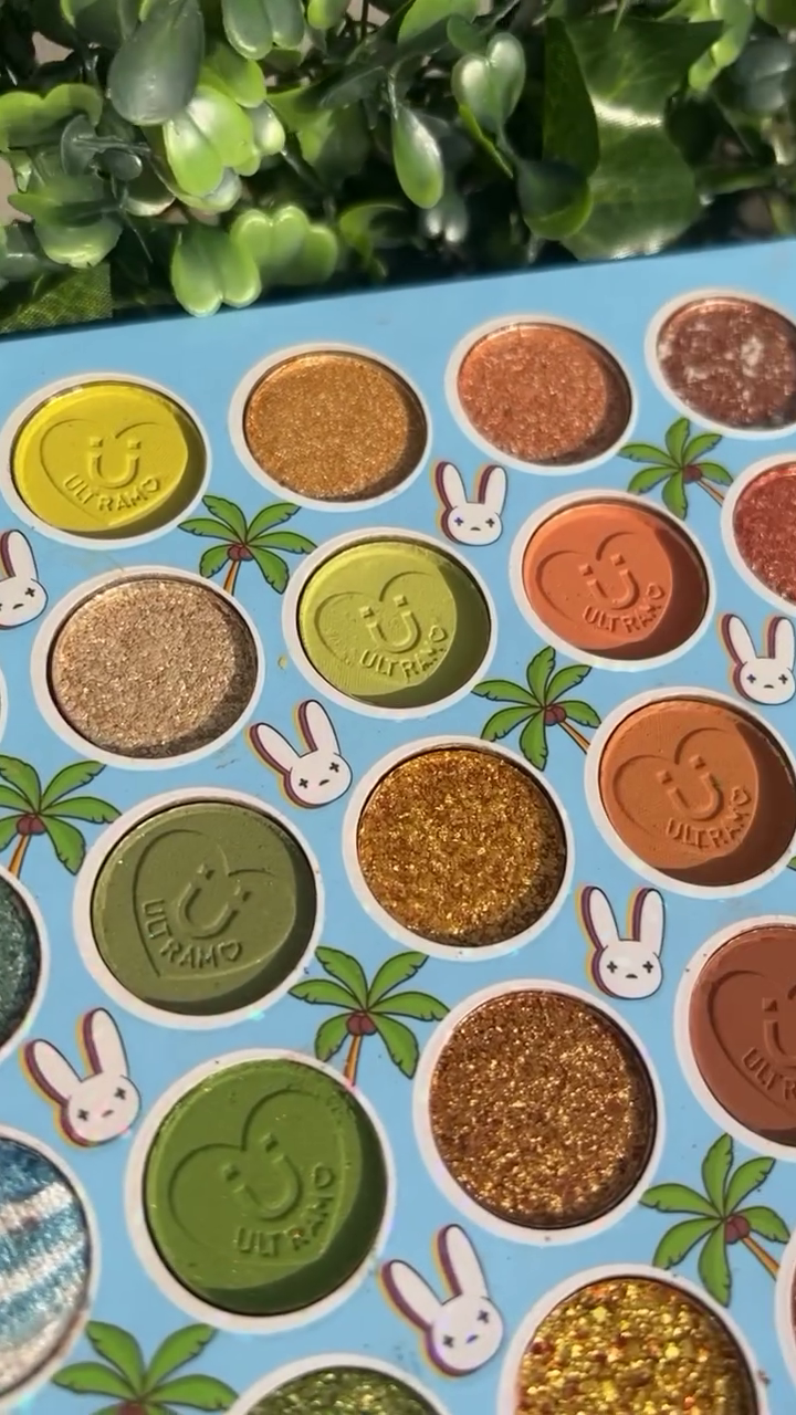 Vibrant 16-Shade Tropical Eyeshadow Palette with Shimmer, Glitter, and Matte Finishes – Featuring Bold Greens, Golds, and Earthy Tones in Playful Bunny-Themed Packaging