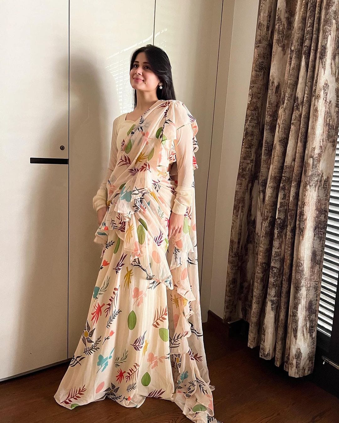 Gunjan Kunwar in Off White Printed Ruffle Lehenga Pre Drapped Saree