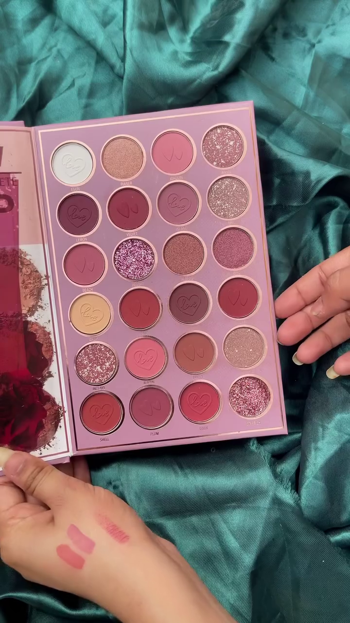 A lip color palette with 24 creamy shades ranging from nudes, pinks, and browns to vibrant reds and corals.