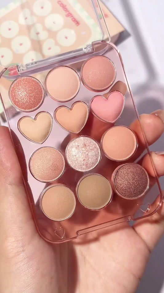 Cute Peach-Themed 12-Color Eyeshadow Palette – Mix of Matte, Shimmer & Glitter Shades with Heart-Shaped Pans for Soft, Romantic & Everyday Eye Makeup Looks