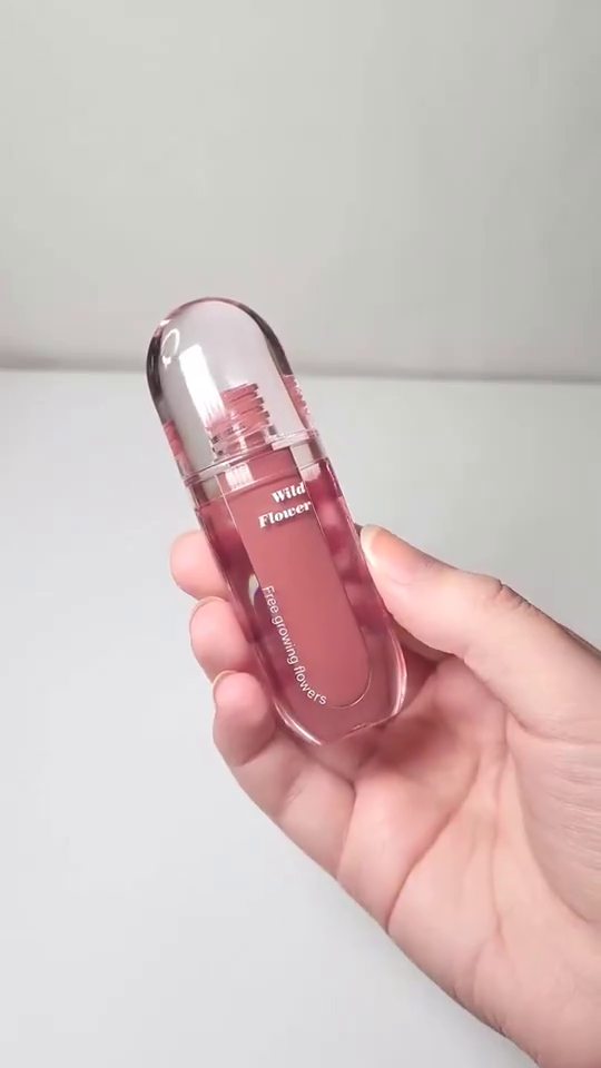 Wild Flower Capsule Lip Gloss – Moisturizing Nude Pink Liquid Lip Color in Aesthetic Transparent Bullet-Shaped Packaging with Floral Design and Smooth Glossy Finish, Ideal for Everyday Wear