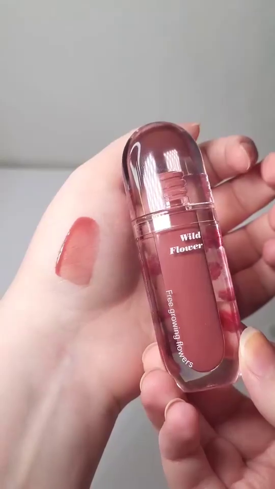 Wild Flower Capsule Lip Gloss – Moisturizing Nude Pink Liquid Lip Color in Aesthetic Transparent Bullet-Shaped Packaging with Floral Design and Smooth Glossy Finish, Ideal for Everyday Wear