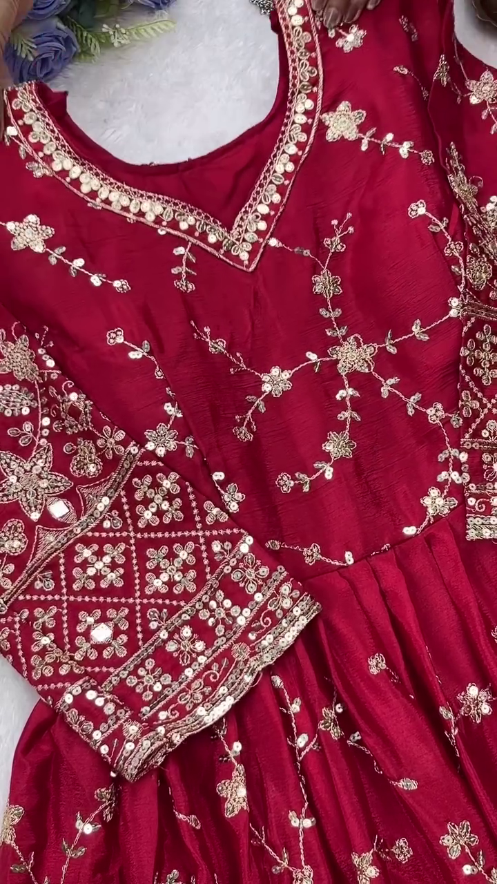 Red Embroidered Anarkali Suit Set with Golden Floral Work, Matching Dupatta, and Traditional Silver Hoop Earrings for Festive Occasions