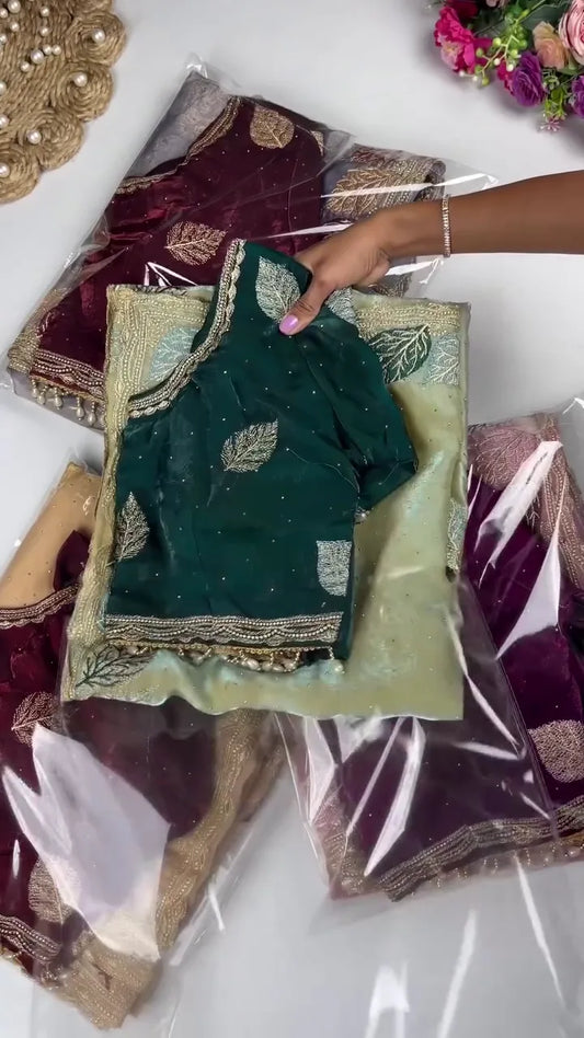 Ready-to-Wear Ensemble: Light Sage Green Saree with Elaborate Gold Border and Leaf Motifs, Featuring a Contrasting Deep Bottle Green Blouse Intricately Detailed with Matching Zari Embroidery and Sequin Accents