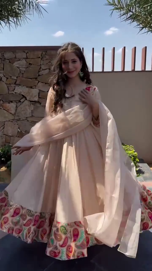 Elegant Beige Anarkali Dress with Colorful Embroidered Hem and Flowing Dupatta – Perfect for Traditional Festive Occasions