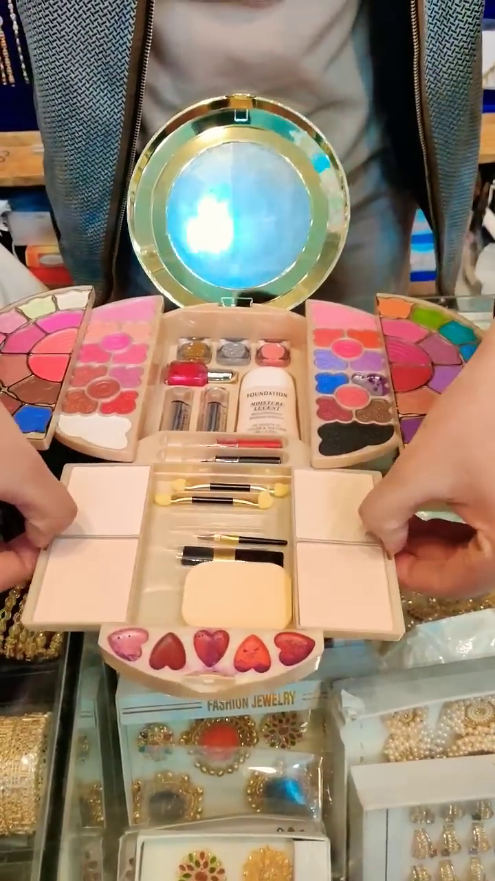 Compact Makeup Kit with Mirror and Multifunctional Palettes - Includes Eyeshadows, Lipsticks, Blushes, Nail Polishes, and Brushes, Perfect for Travel and On-the-Go Touch-Ups