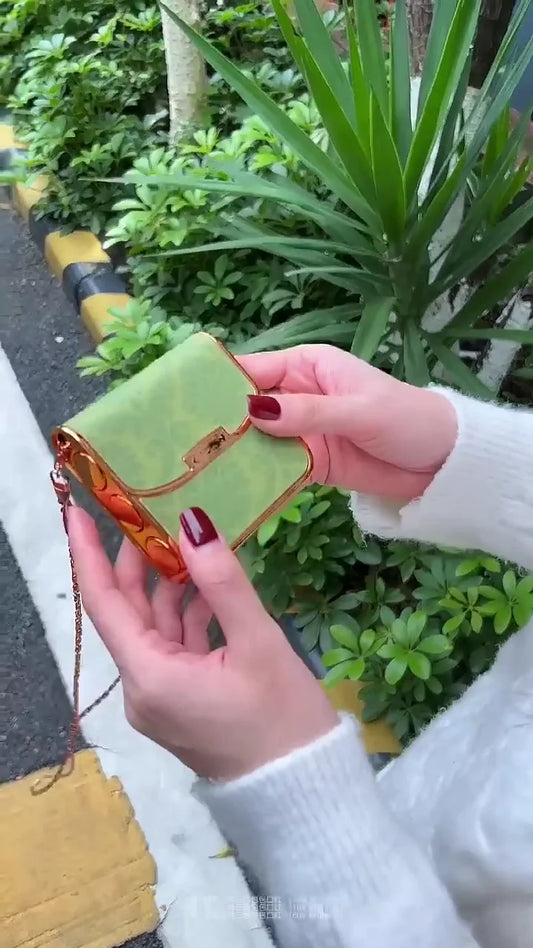 Stylish Green Lipstick Case with Chic Gold Accents and Bold Red Lipstick – Perfect for On-the-Go Glam