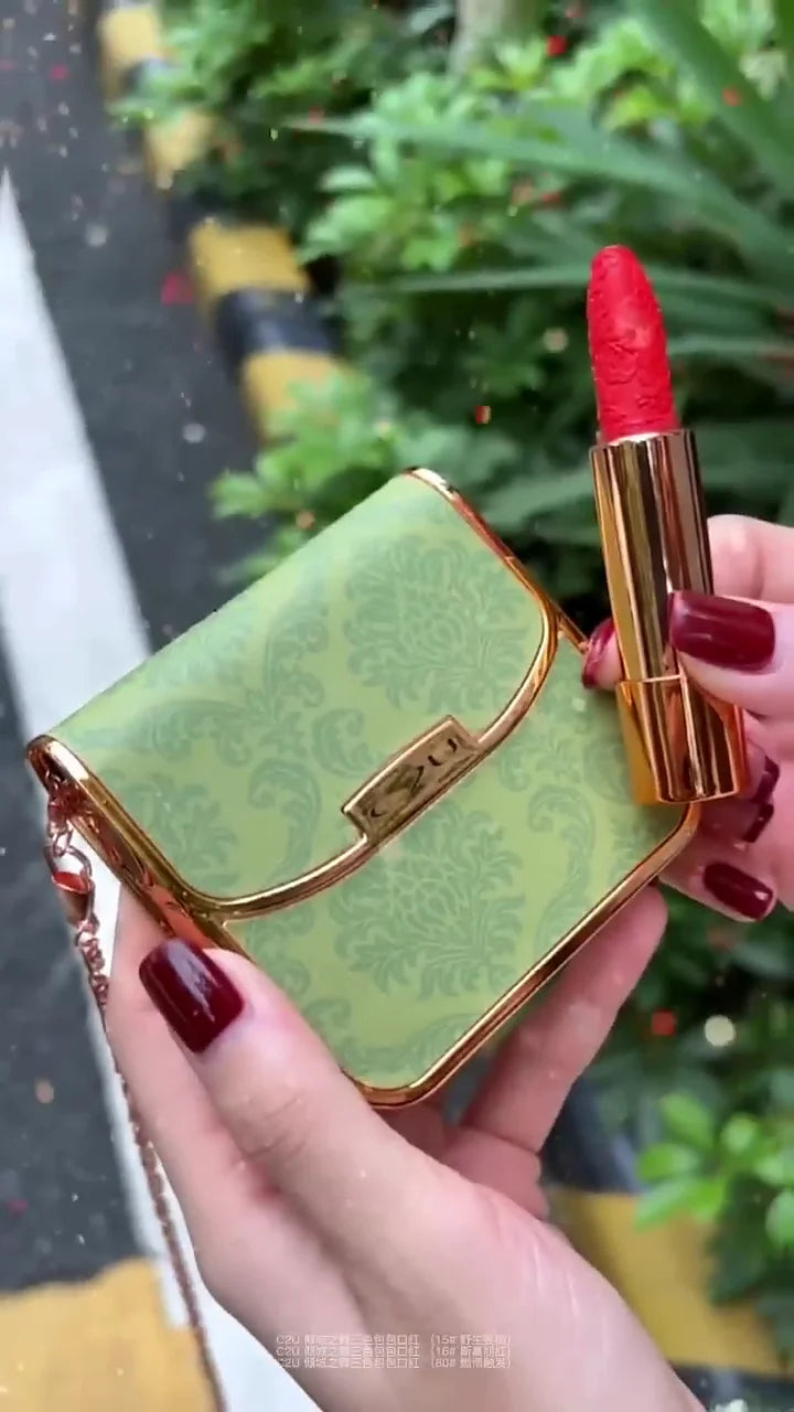 Stylish Green Lipstick Case with Chic Gold Accents and Bold Red Lipstick – Perfect for On-the-Go Glam