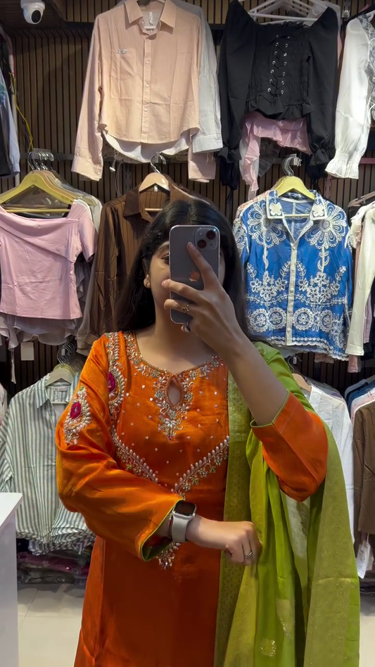 Orange Silk Suit with Intricate Embroidery, Matching Green Chiffon Dupatta, and Flared Pants for Traditional Festive Occasions