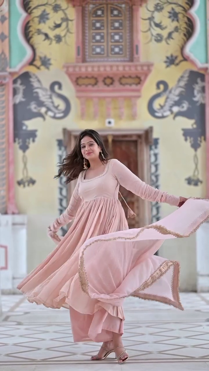 Peach Pink A-Line Anarkali Dress with Delicate Embroidered Borders and Soft Georgette Fabric, Perfect for Festive and Traditional Occasions