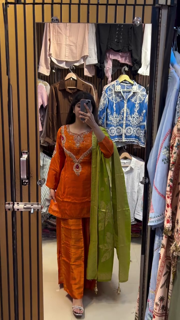 Orange Silk Suit with Intricate Embroidery, Matching Green Chiffon Dupatta, and Flared Pants for Traditional Festive Occasions