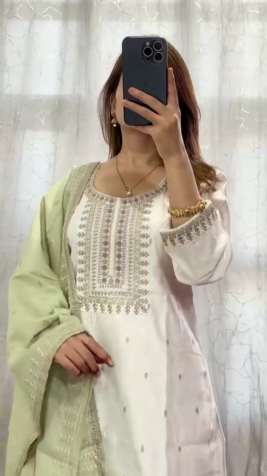 Delicate White Embroidered Kurta with Intricate Threadwork, Paired with Soft Green Dupatta and Slim-Fit Trouser for Elegant Traditional Wear"