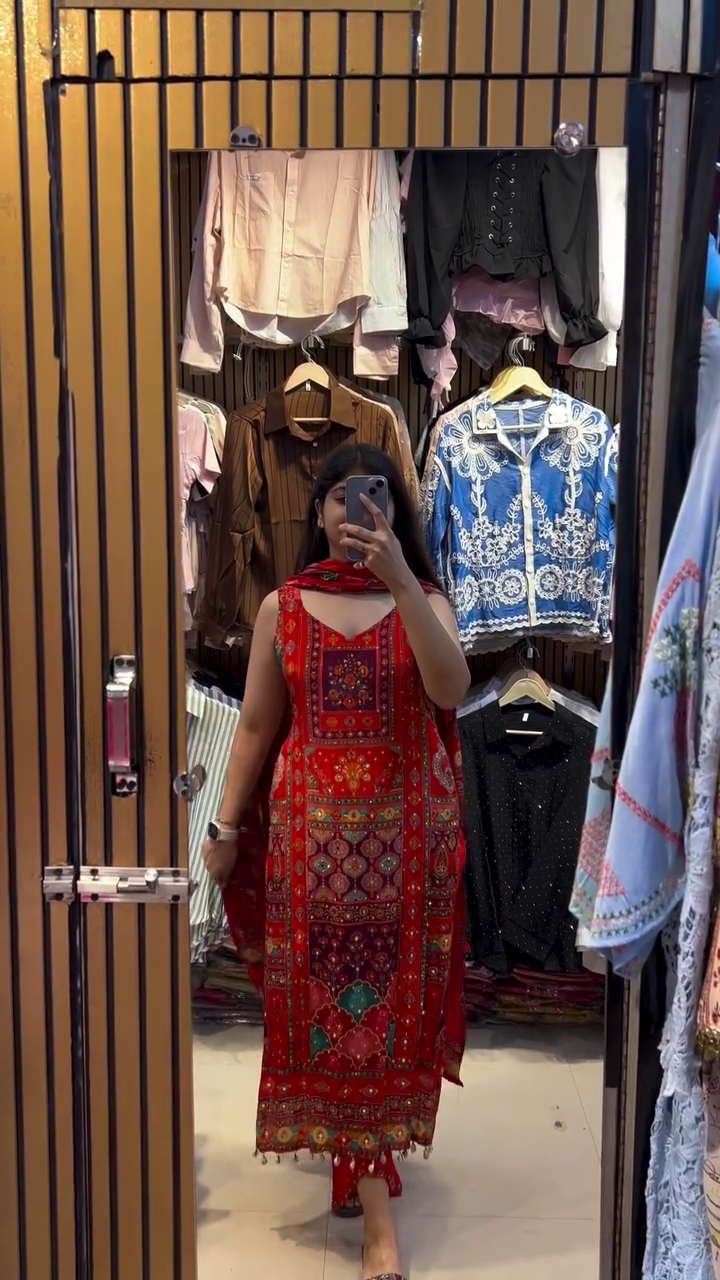 Traditional Red Embroidered Kurta Set with Colorful Geometric Patterns, Tassel Detailing, and Matching Dupatta for a Regal Festive Look