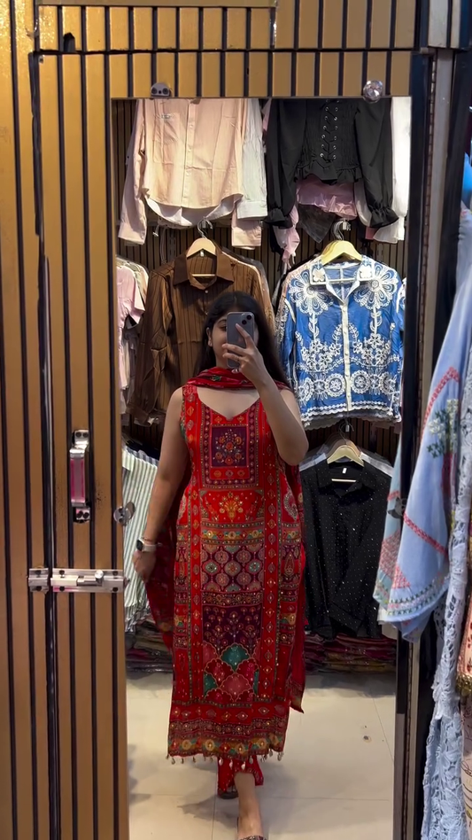 Traditional Red Embroidered Kurta Set with Colorful Geometric Patterns, Tassel Detailing, and Matching Dupatta for a Regal Festive Look