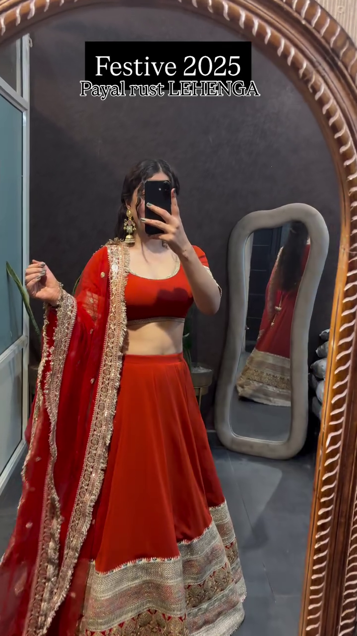 Festive Rust Payal Lehenga with Red Chiffon Dupatta and Intricate Golden Embroidery for a Stunning Traditional Look