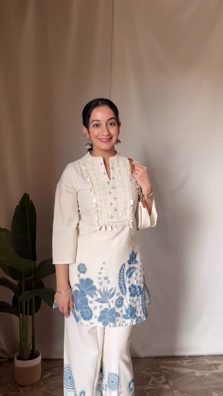 Embroidered Off-White Kurti Set – Featuring Intricate Floral Motifs, Tassel Detailing, and Comfortable Palazzo Pants for a Chic Traditional Look