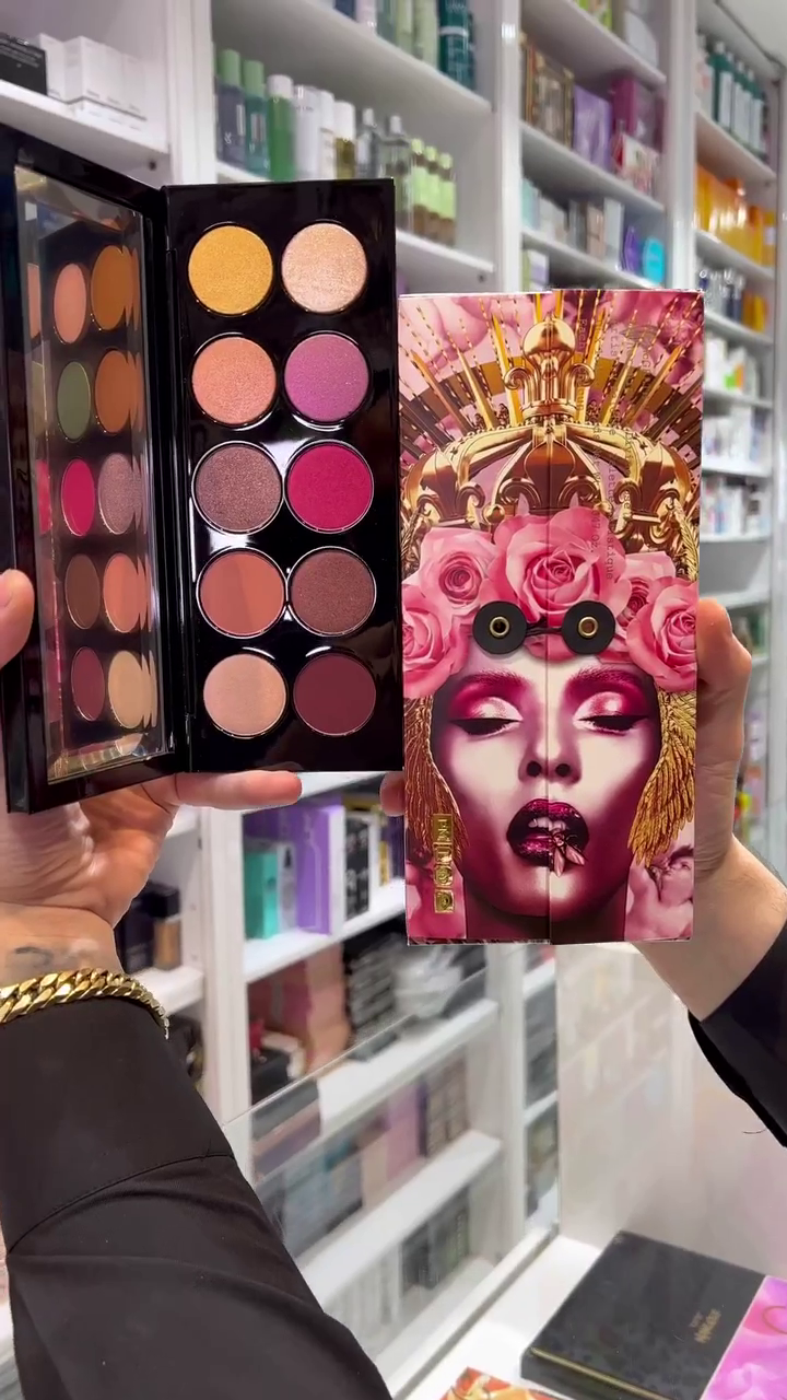 This is a vibrant and stylish eyeshadow palette featuring rich, bold shades of pinks, purples, and warm tones. The packaging is eye-catching with an artistic design