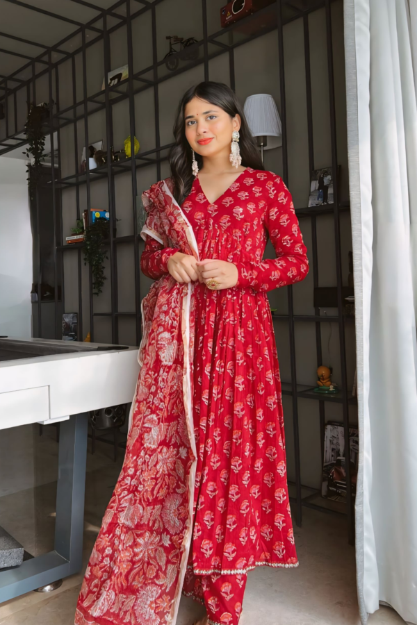 THE RED TRADITIONAL ANARKALI PAIRED WITH CHURIDAR AND DUPATTA