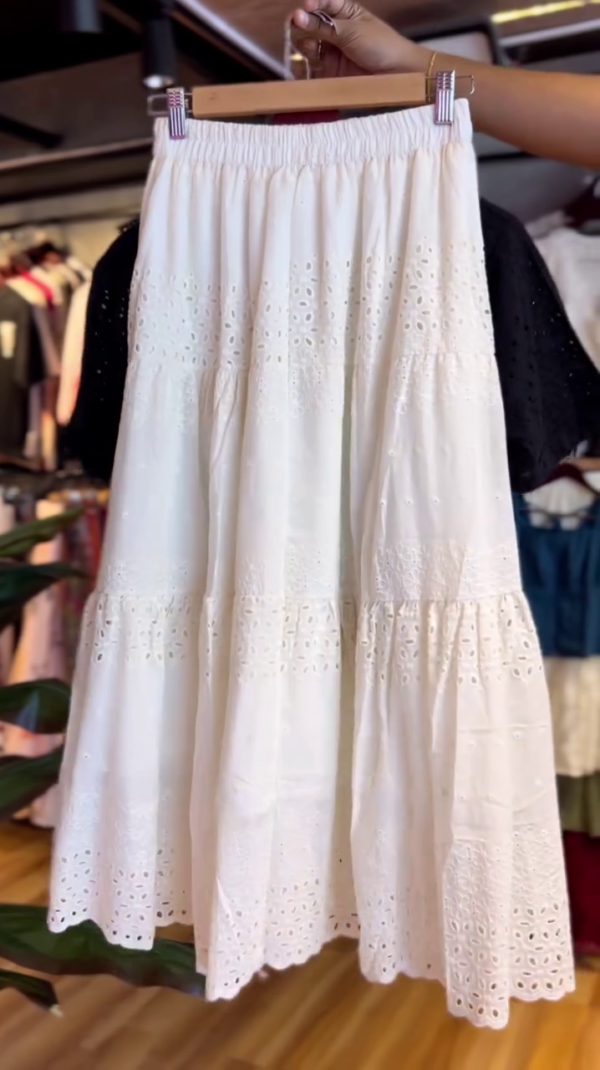 Two-Piece Cotton Co-Ord Set Featuring a Black Short Sleeve Button-Up Broderie Anglaise Top and a White High-Waisted Tiered Midi Skirt with Eyelet Embroidery Detailing – Perfect for Casual Summer Days or Chic Outings - Image 2